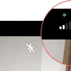 What are the green and orange dots in my iPhone and iPad status bar?