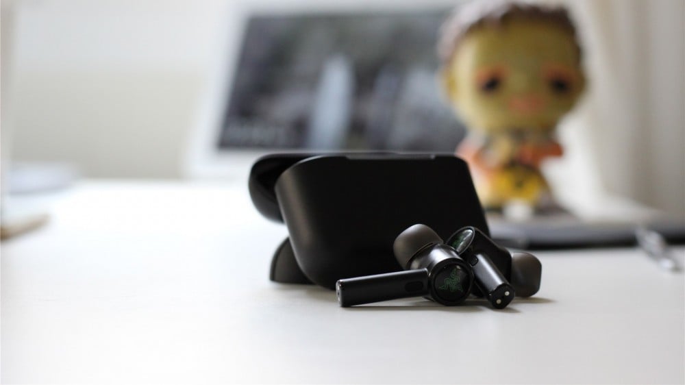 The Razer Hammerhead Pro earbuds in front of the case 