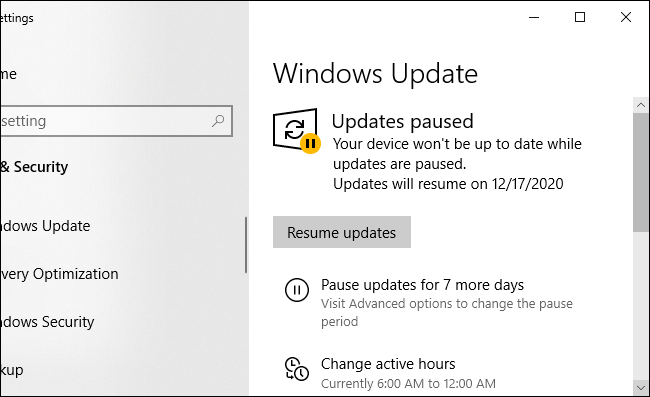 Windows Update showing updates are paused with a "Resume updates" button.