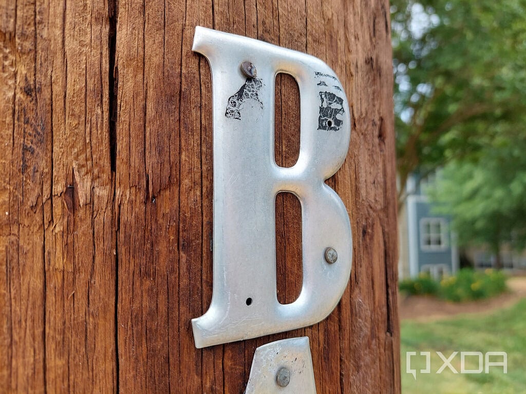 Photo of a letter 'B' on a wooden post