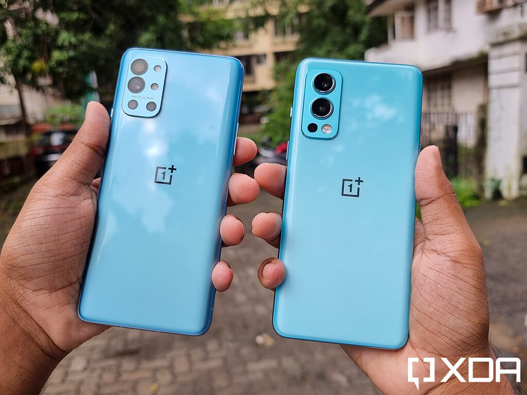OnePlus 9R and OnePlus Nord 2 held out in hand to show the difference in their blue colors