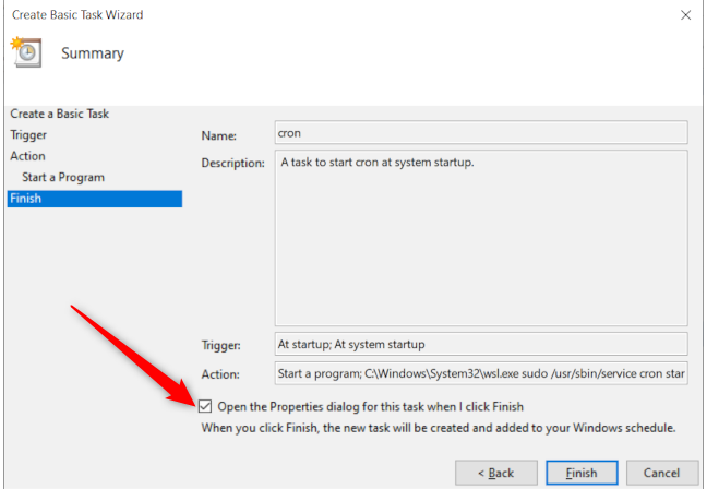 Windows 10's Task Scheduler's final task creation window with a red arrow pointing to the option to open the task properties window at finish.