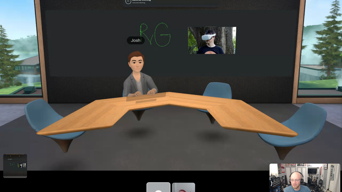 A VR conference room with a person at a table