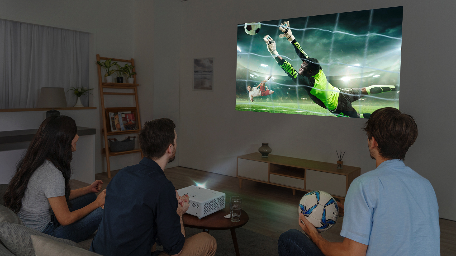 A group of friends enjoying the Optoma UHZ50 short throw projector.