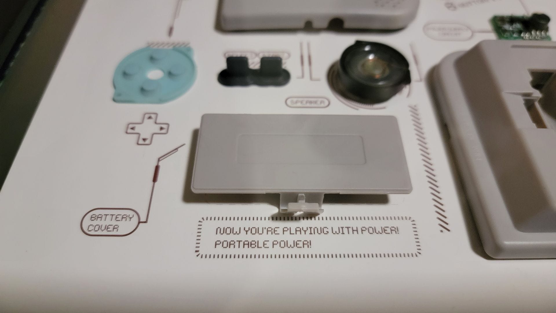 Close up of battery cover of Xreart Nintendo Game Boy Pocket framed art