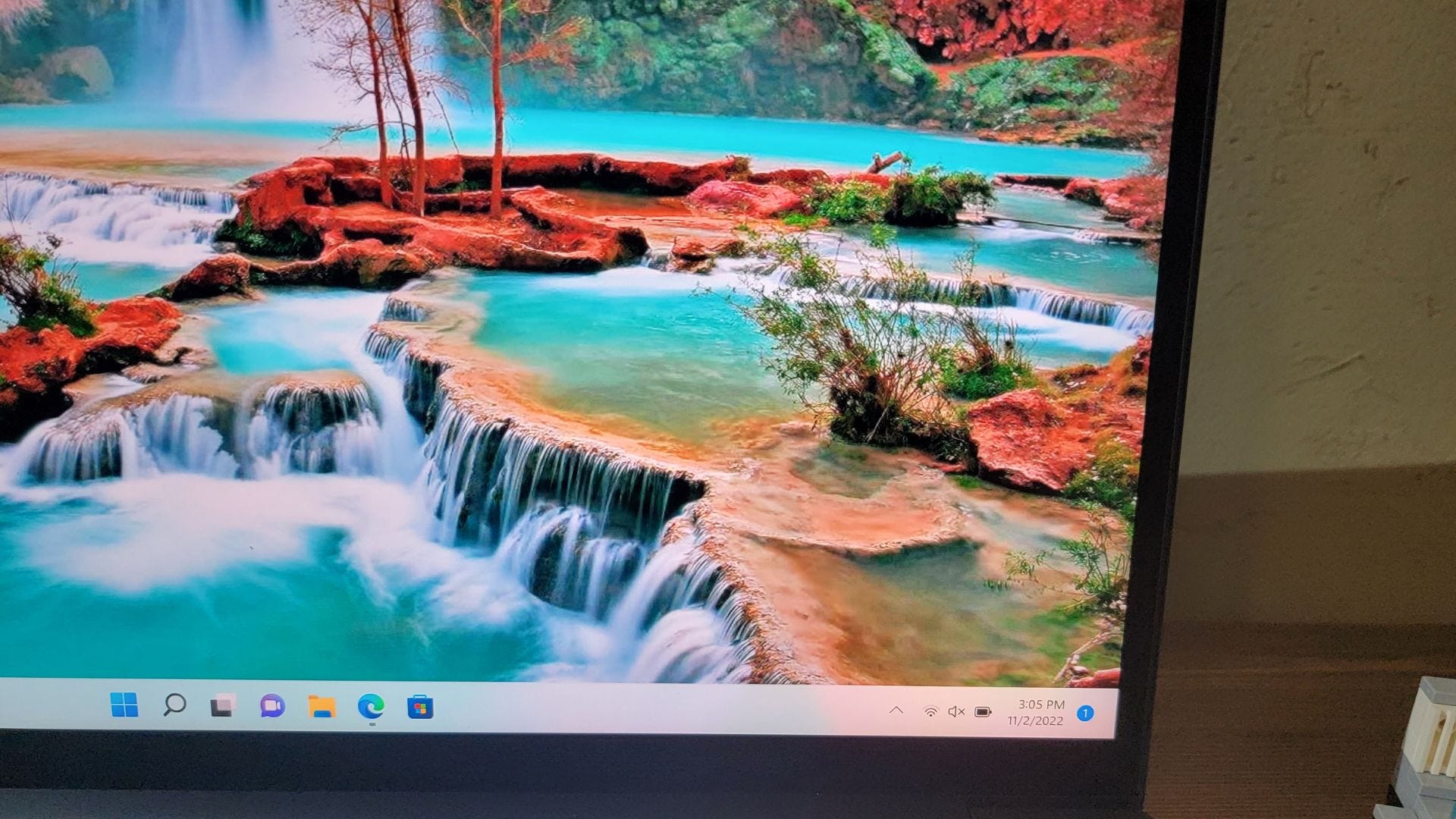 Close up of Lenovo ThinkPad X1 Extreme Gen 5 display showing natural lake desktop wallpaper