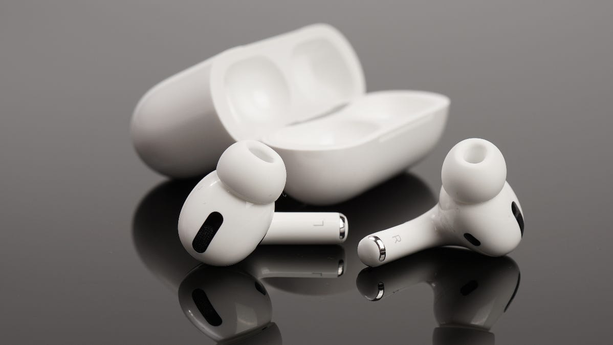 AirPods Pro outside of charging case lying on a gray table