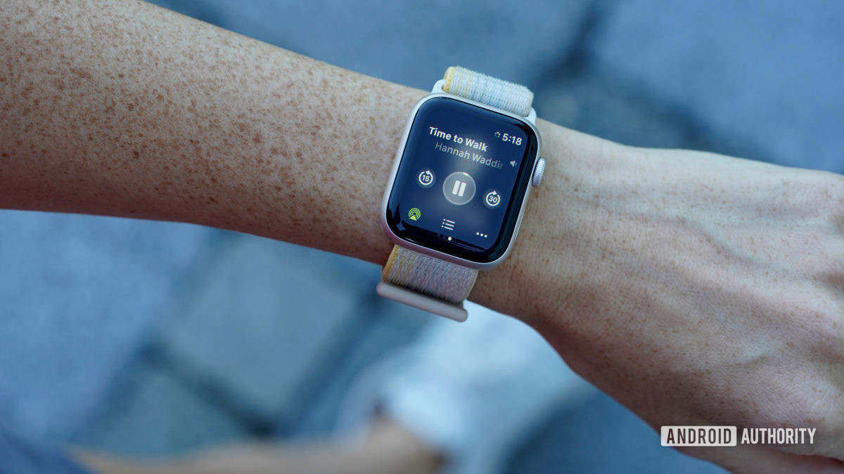 An Apple Watch SE 2 on a user's wrist displays a Time to Walk workout in progress.