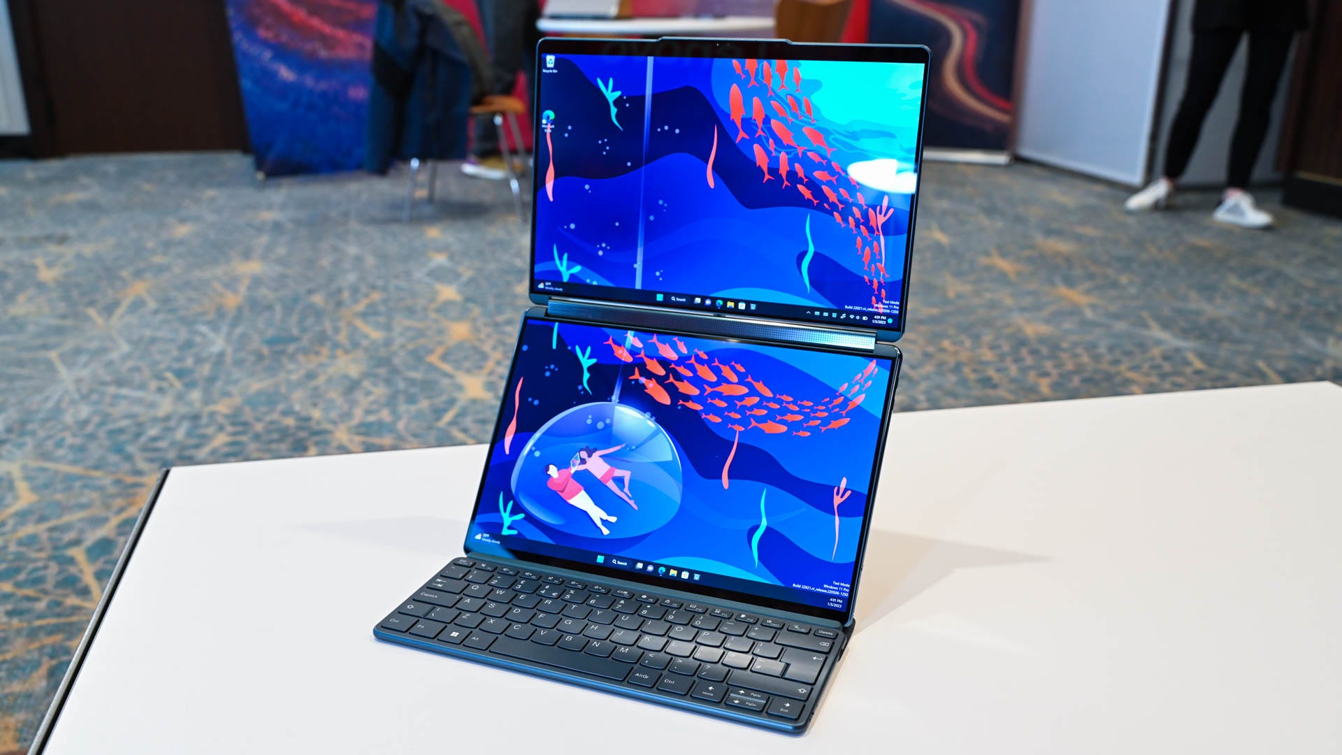 Lenovo Yoga Book 9i in a stacked orientation, with one display placed atop another.