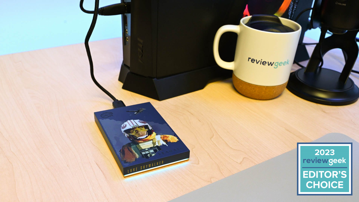 Seagate 2TB Luke Skywalker External HDD plugged in on a desk with a coffee mug.