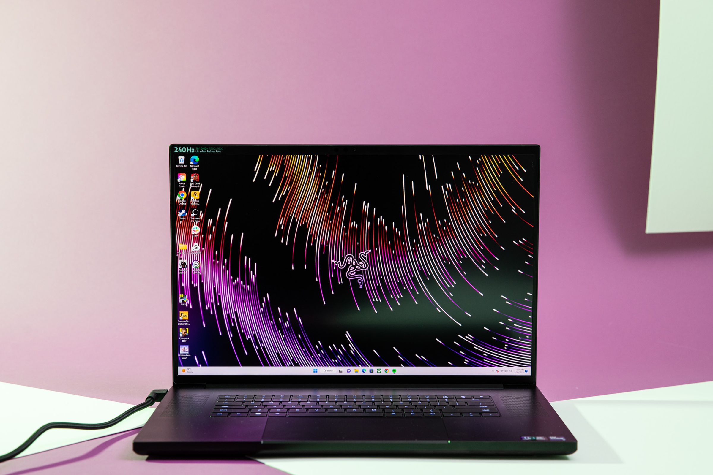 The Razer Blade 18 open, displaying a desktop background with fireworks.