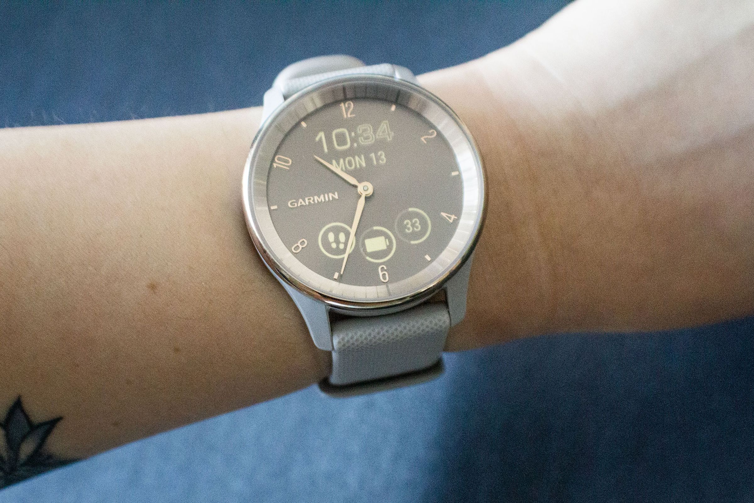 Shot of Garmin Vivomove Trend on a person’s watch with the hidden display visible.