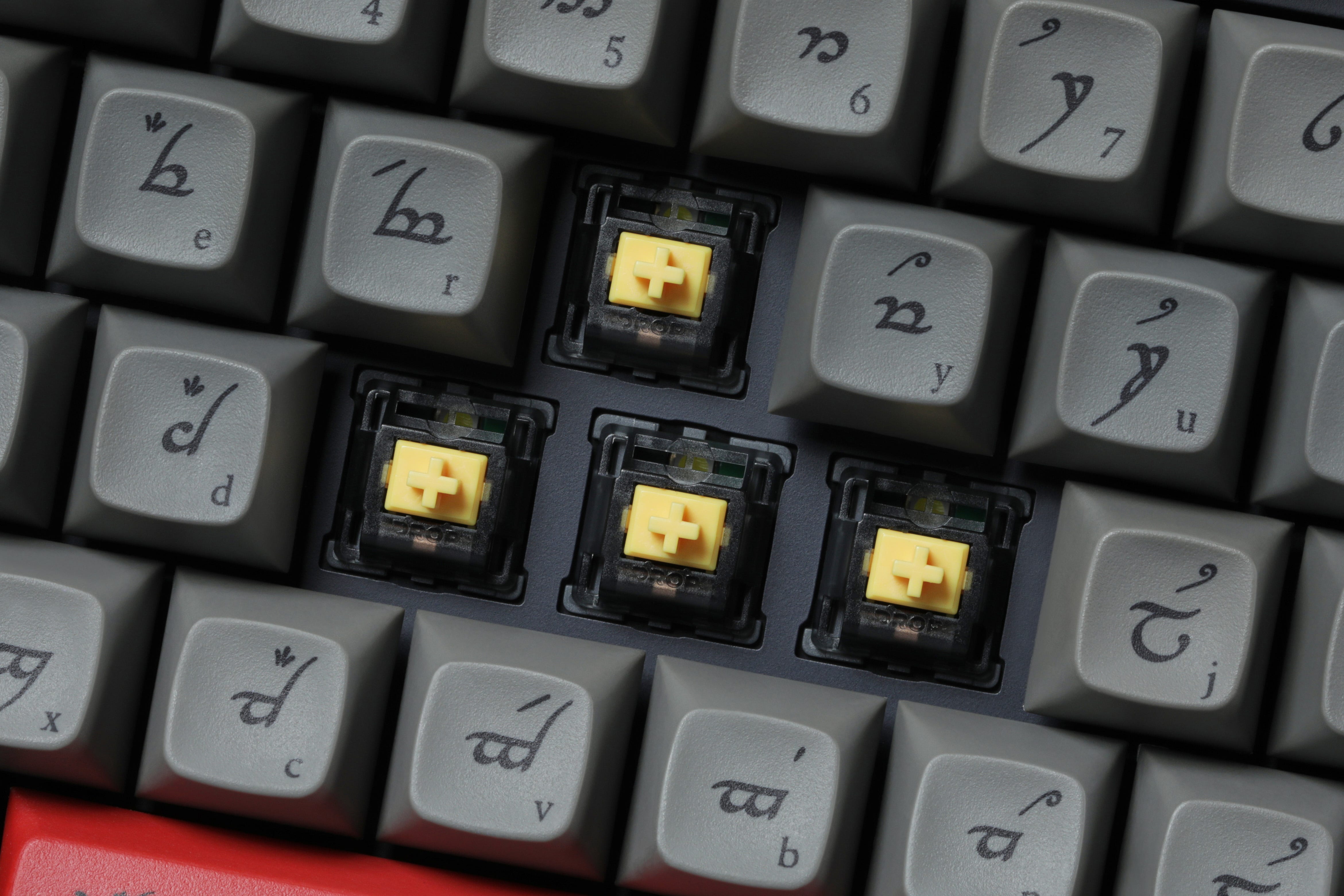 A photo of the Holy Panda X switches on the Drop Black Speech keyboard.