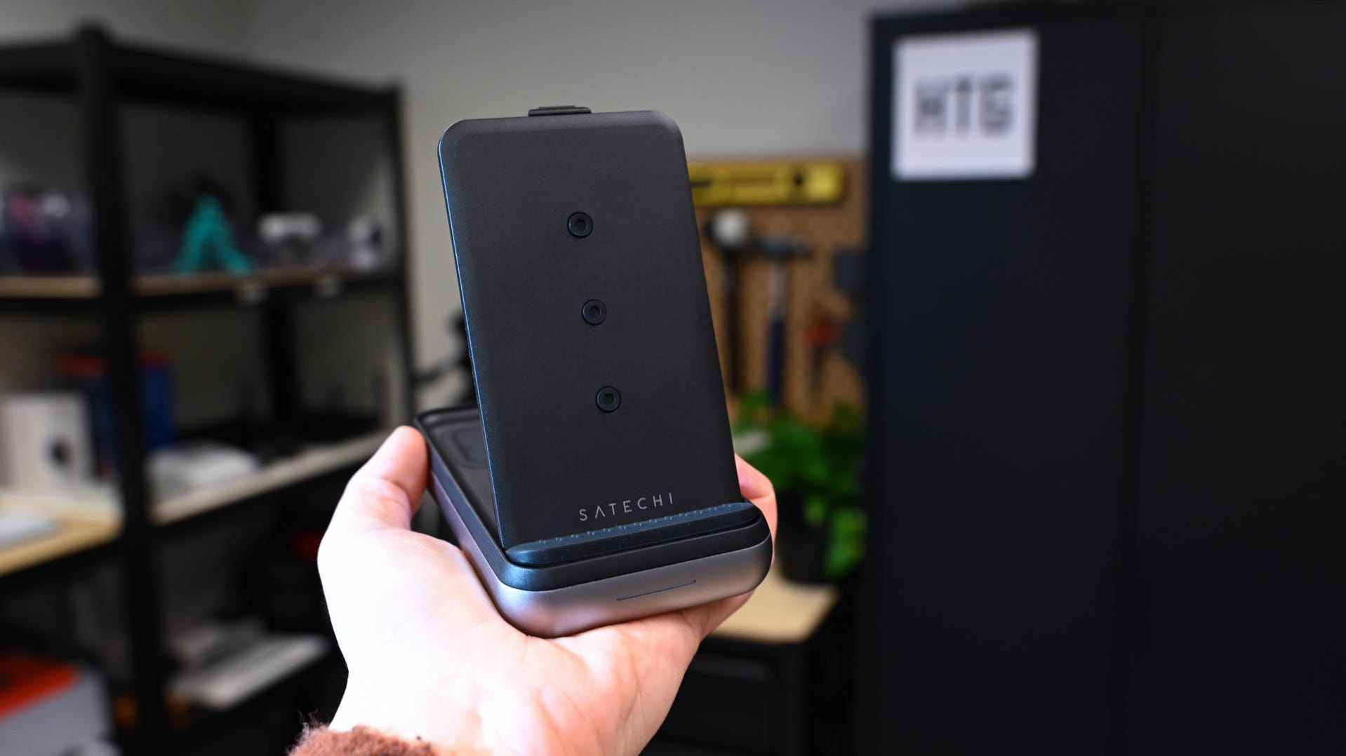 Person holding the Satechi Duo Wireless Charger Power Stand
