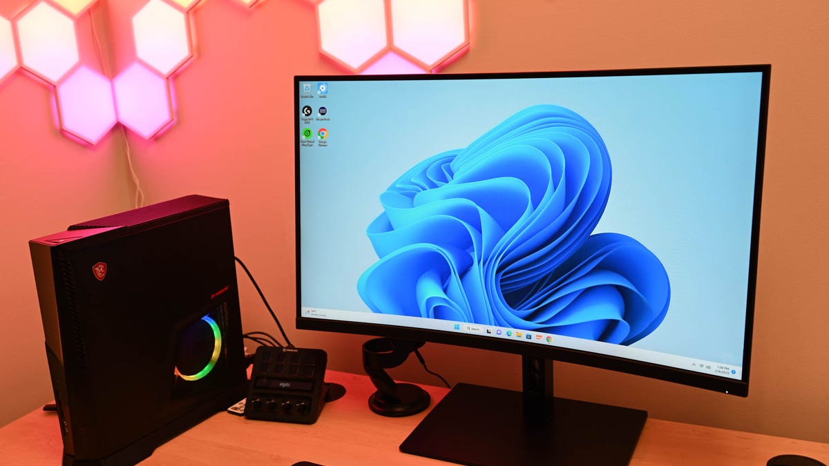 A desktop PC running Windows 11 with some RGB accessories.