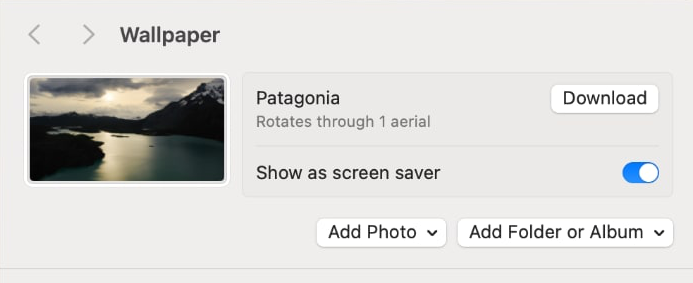 The "Show as screen saver" setting enabled in the macOS wallpaper settings