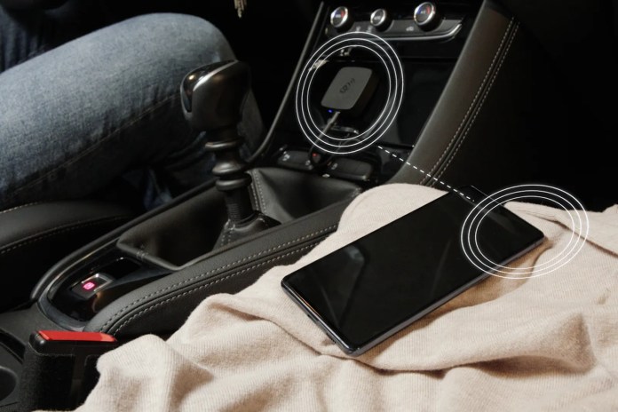 The AAWireless Android Auto Adapter sitting in a vehicle