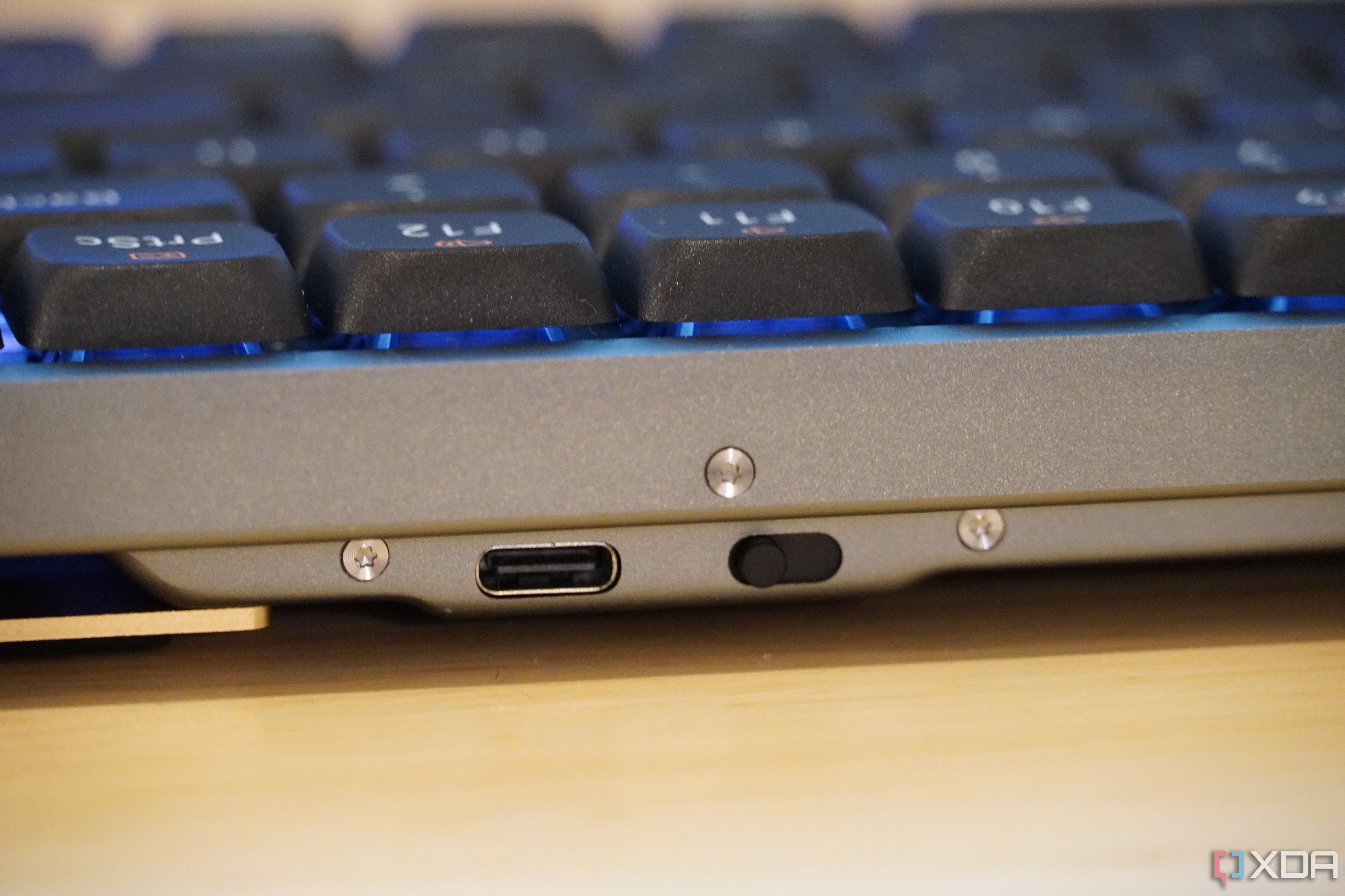 The power switch and USB-C port on a Lofree Flow keyboard.