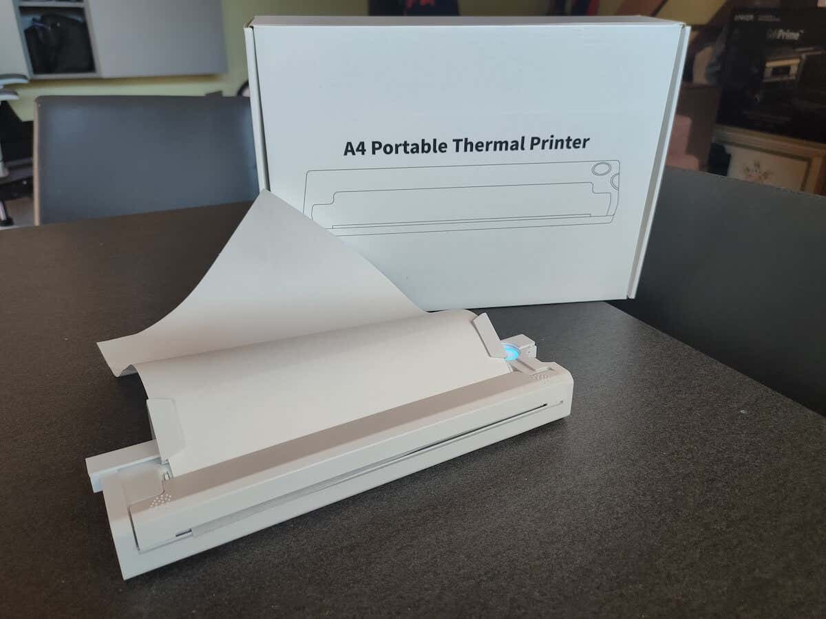 A4 Portable Thermal Printer with paper on desk