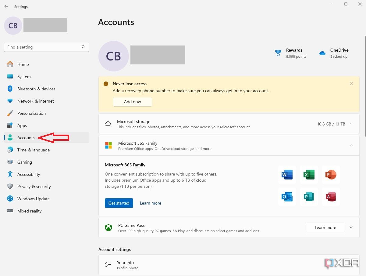 Windows 11 settings menu with accounts arrow