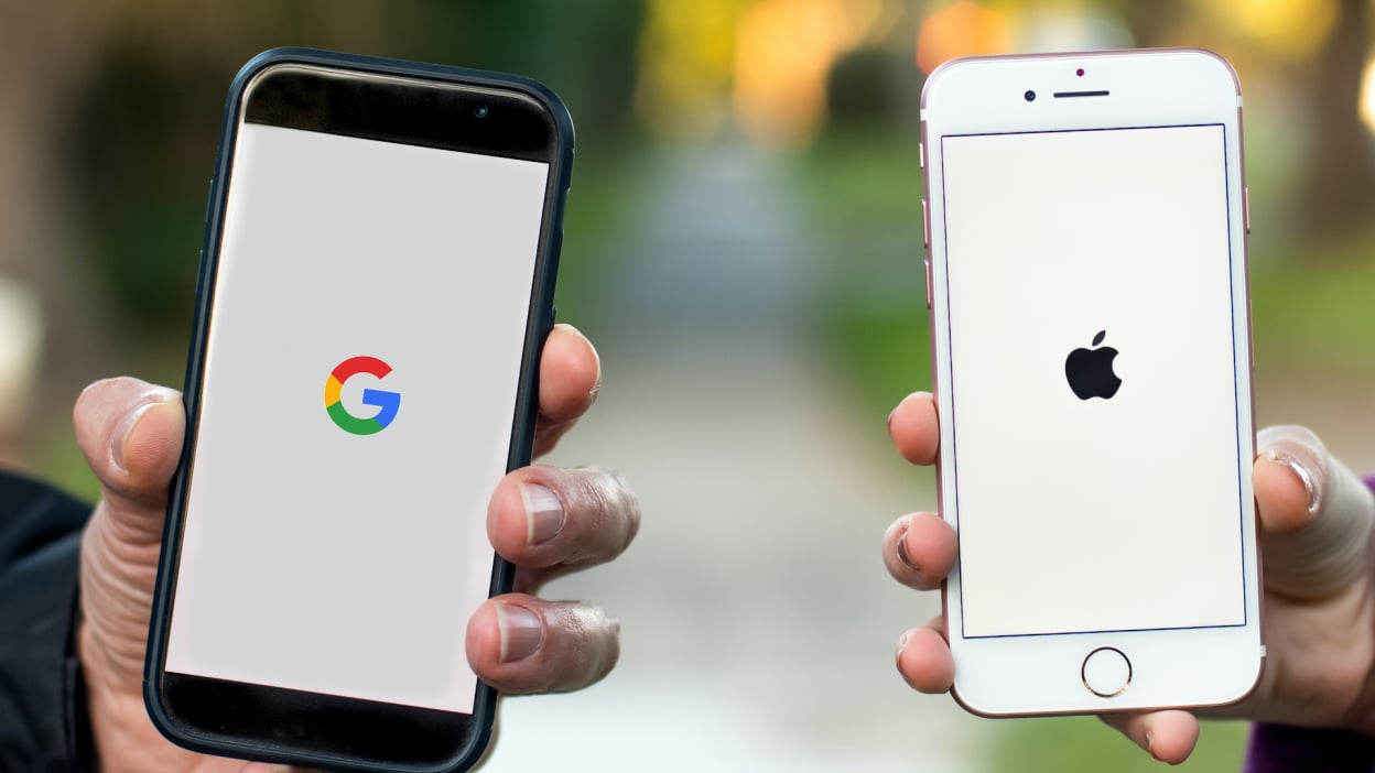 two smartphones with google and apple logos on them, respectively